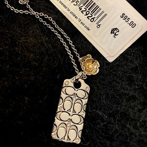 Silver Coach necklace with gold and diamonds